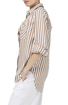 A classic striped cotton-poplin shirt adds a playful note by switching up the pattern on the chest pocket. 28 1/2" to 31" length (size Medium) Curved hem Spread collar Long sleeves with button cuffs 100% cotton Machine wash, tumble dry Imported Brown And White Striped Shirt Outfit, Beige Striped Shirt Outfit, Striped Shirt Outfit, Autumn Shopping, French Wardrobe, Wardrobe Capsule, Cotton Poplin Shirt, Poplin Shirt, Work Outfits