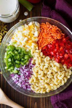 the pasta salad is prepared and ready to be eaten in the bowl on the table