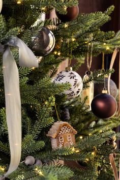 a christmas tree with ornaments hanging from it