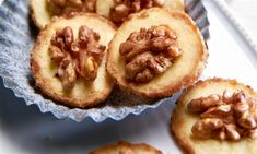 some cookies with walnuts are on a plate