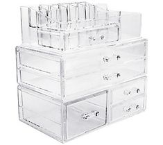 three clear drawers stacked on top of each other in front of a white background with the bottom drawer open