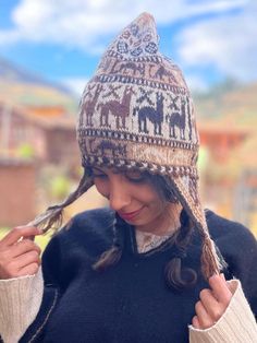 Andean alpaca wool beanie. This beautiful beanie is made by Hilaria from the Chahuaytire community, a part of the Quechua people living in the Sacred Valley of the Inka's in the Peruvian Andes.  ⛰️Chahuaytire community is known to be the best weavers among the Quechua people.  They maintain their ancestral knowledge of plants and weaving and bring it to the present.  🧵🦙They are involved in every part of making their products.  They have their own alpaca and lamas which they take care of, and obtain their wool out of. They make their own natural dies from indigenous plants belonging to their region.  🫶🏼They have a strong connection with nature and all of their designs are a reflection of the nature, The beanie has a very smooth soft feeling. It is not itchy like sheep wool. Cozy Alpaca Hats For Fall, Alpaca Beanie For Outdoor, Adjustable Alpaca Hat For Outdoor, Outdoor Alpaca Beanie Hat, Alpaca Hat For Outdoor Winter Use, Winter Outdoor Alpaca Hat, Alpaca Winter Hat For Cold Weather, Winter Alpaca Hat For Cold Weather, Cozy Alpaca Beanie Hat