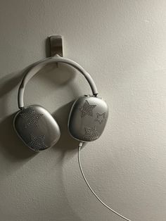 a pair of headphones hanging on the wall