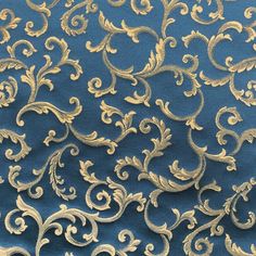 gold and blue fabric with swirls on it