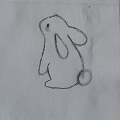 a drawing of a dog with a ball in its mouth, on a piece of paper