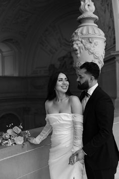 a man and woman standing next to each other