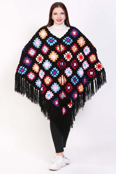 Feeling festive and fabulous in our cozy crochet poncho! ✨ This versatile piece is perfect for layering all season long. Get yours now and add some holiday cheer to your wardrobe! #christmasfashion #crochetponcho #holidaystyle #usamade Black Bohemian Shawl For Fall, Black Bohemian Poncho Shawl, Bohemian Yarn Poncho For Fall, Bohemian Yarn Crochet Top, Bohemian Knit Poncho With Fringe, Bohemian Knitted Shawl For Beach, Bohemian Black Poncho For Fall, Spring Crochet Poncho Shawl, Bohemian Knitted Poncho For Fall