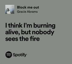 an ad for spotify with the caption'i think i'm burning alive, but nobody sees the fire '