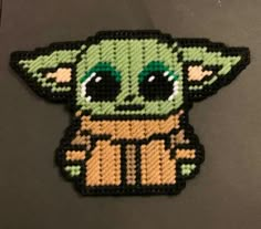 a close up of a small patch with an image of a baby yoda