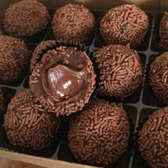 chocolate truffles in a box with frosting on the top and bottom