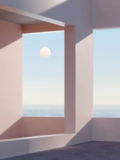 an empty room with the ocean in the background