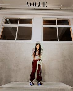 a woman standing in front of a building