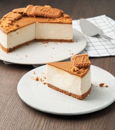 two slices of cheesecake sitting on top of plates