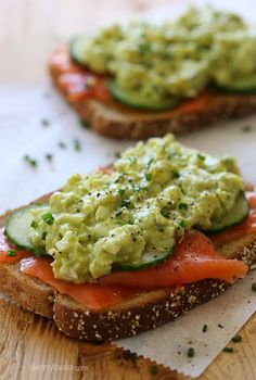 an open face sandwich with avocado and salmon