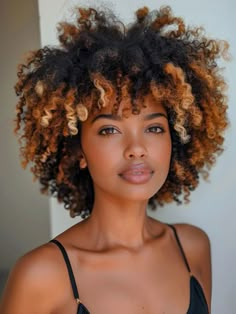 For those with natural afro-textured hair, adding caramel highlights can enhance the hair’s voluminous shape and texture. This style is perfect for embracing natural curls and suits any face shape, enhancing the golden undertones of darker skin. Honey Brown Afro Hair, Honey Blonde Afro Dark Skin, Fall Curly Hair Color Highlights, Blonde Afro Hair Black Women, Natural Hair With Highlights, 4c Hair Color Ideas, Afro Shapes, Afro Hairstyles For Women, Honey Blonde Curls