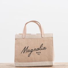 Magnolia Script Market Tote | Magnolia Spring Travel Canvas Bag With Leather Handles, Brown Linen Bag For Everyday Use, Everyday Linen Canvas Bag With Leather Handles, Beige Linen Shopping Bag, Casual Bags With Rolled Handles For Errands, Beige Canvas Bags With Rolled Handles, Spring Canvas Tote Bag With Leather Handles, Beige Shopping Bags With Reinforced Handles, Beige Shopping Bag With Reinforced Handles