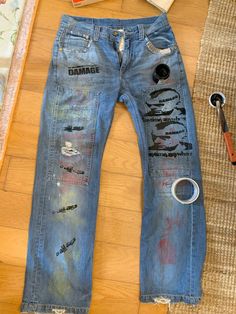 Screenprints and spray paints Spray Painted Jeans, Custom Painted Jeans Y2k, Spray Paint Jeans, Spray Paint Clothes, Punk Bleached Jeans, Skull Painted Jeans, Kurt Cobain Patched Jeans, Graphic Jeans, Paint Jeans