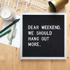 a sign that reads dear weekend, we should hang out more with some pens and pencils next to it