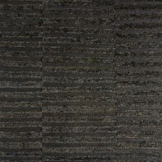 an area rug with black and grey stripes