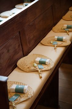 the table is lined with wicker place mats and wrapped in twine, along with napkins on them