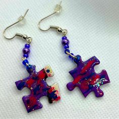 Real Puzzle Piece Earrings. Coordinating Beads To Enhance The Look. Fun To Wear Any Time. Puzzle Piece Is Dipped In A Sealer. Not To Be Submerged In Water. Back Of Piece Is Finished In A Solid Silver Color. Great For Gift Giving, Stocking Stuffers, Or To Share With Friends. Each Piece Is Unique. This Pair Has Colors Of Purple, Blue, Pink, And White; With A Sprinkle Of Glitter. Many Other Colors And Patterns Also Listed. Non Smoking Home. Nwot. Never Worn. $10 Each Or 2 For $18. Puzzle Size 3/4” Artsy Purple Drop Earrings, Handmade Artsy Purple Jewelry, Artsy Handmade Purple Jewelry, Artsy Purple Jewelry For Gifts, Artsy Purple Dangle Earrings, Creative Creations, Puzzle Piece, Puzzle Pieces, In Water