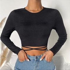 Long Sleeve Rib-Knit Crop Top With Criss-Cross Self-Tying Waist Detail. Brand New. Never Worn. Can Be Dressed Up Or Down. **Sold Out Online. 100% Polyester. Measurements: Bust- Approx 13” Length- Approx 14.5” Open To Offers. Bundle & Save. All Clothes Are Steam Cleaned Before Shipping. *Free Gift With Purchase Of $20 Rib Knit Crop Top, Camo Crop Top, Knitted Crop Tank Top, Bell Sleeve Crop Top, Floral Print Crop Top, Satin Crop Top, Backless Crop Top, Tie Dye Crop Top, Tie Crop Top