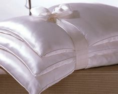 White silk charmeuse cover, hand-strung silk filling. Bed Pillow Sizes, Neck Roll Pillow, Essential Amino Acids, Satin Bedding, Thai Silk, Bedding Essentials, Down Comforter, Bed Pillow, Silk Pillow