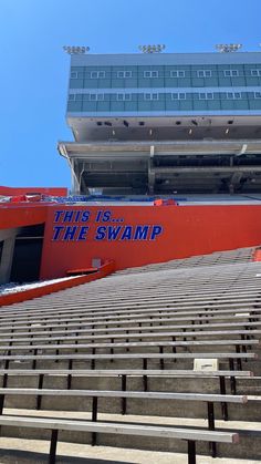 an empty bleacher with the words this is the swamp on it's side