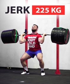 a man is doing a squat with two large barbells