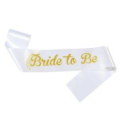 the bride to be sash is white with gold lettering