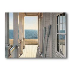 an open door leading to the beach with water and sky in the background on a white wall