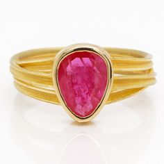 Details: Ruby, pear shape, rose cut, 1.56 carats, 7.5x9.5mm Three ribbon ring in 18k yellow gold with contrasting satin and polished finish Ring Size 6.5 Explore Barbara Heinrich's Bio & Catalog here. Please contact us for resizing options, special order inquiries, or any other questions. Gold Pear-shaped Ruby Ring, Pear-shaped Yellow Gold Ruby Ring, Ribbon Ring, Nail Jewels, Druzy Ring, Pear Shaped, Rose Cut, Ruby, Ribbon