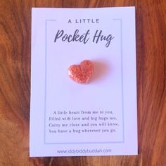 a little pocket hug card with a pink heart on it's front and back