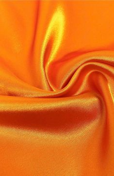 INFORMATION: This beautiful Stretch Charmeuse Sayin Fabric has a beautiful smooth shiny satin side with a modest matte finish on the back. The fabric is tightly woven and has a light 2-way vertical stretch, making it extremely durable. In addition, our stretch charmeuse is approximately 7 ounces per linear yard which is a better construction than most standard stretch charmeuse fabrics. This heavier gsm (grams per square meter) gives the fabric a richer feeling and a better hold when draping. Th Couture Gown, Orange Satin, Orange You Glad, Shiny Fabric, Net Fabric, Orange Fabric, Couture Gowns, Square Meter, Stretch Satin