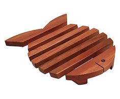 a wooden fish shaped cutting board on a white background