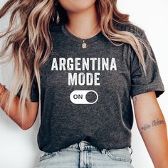 Argentina Mode T-Shirt, Love Argentina Shirt, Argentina Vacation, Argentina Family Trip, Honeymoon Shirt, Travel T-Shirt, Argentinian Shirt * Bella + Canvas 3001 Unisex T-shirt * 100% combed and ring-spun cotton (Heather colors contain polyester) * Pre-shrunk fabric * Feels soft and lightweight * Fits true to size HOW TO ORDER 1. Select your desired size, color and quantity from the drop-down menus. 2. Click "Add to Cart" and proceed to checkout. SIZING Please see the size chart image for specific measurements. NOTE ON TEXT/GRAPHICS COLORS For lighter-colored shirts, please note that any white graphics or text will print as black. You can see an example of this in our color chart, where black text indicates this change. RETURNS Due to the personalized nature of our made-to-order products, Argentina Vacation, Argentina Shirt, Mexico Gift, Mexico Shirts, Mexican Shirts, Text Graphics, Honeymoon Shirts, Porto Rico, Family Trip