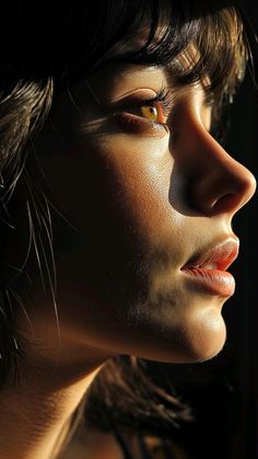 a woman's face is lit by the light coming through her eyes and nose