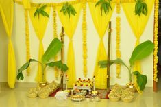 a decorated stage with yellow drapes and decorations