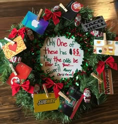 a christmas wreath that has been decorated with various types of magnets and other items