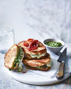 there is a sandwich on the plate with a knife