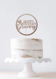 a white cake topped with a happy birthday cake topper