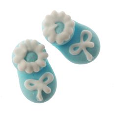 two blue and white beads with flowers on them