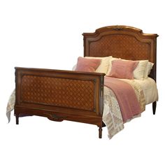 a bed with a wooden headboard and foot board