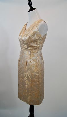 "This is a great vintage 1950s dress suit. It is a beige and gold brocade pencil dress with a v-neckline and a metal zipper up the back. It has a matching 3/4 sleeve jacket with a button closure. It is fully lined and in excellent condition. Size: Small bust: 35\" waist: 29\" Hips: 38\" length: 36\"" Gold Brocade Dress, Vintage 1950s Dress, Brocade Dress, Womens Suits, Gold Brocade, Dress And Jacket, Brocade Dresses, Vintage 1950s Dresses, Dress Suit