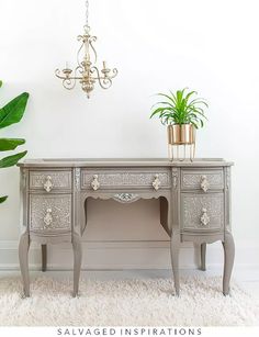 a desk with two drawers and a potted plant on top