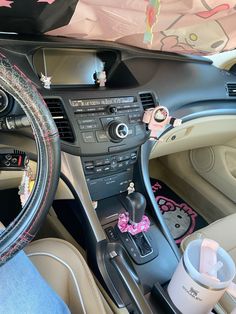 the interior of a car decorated with hello kitty stickers