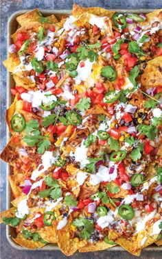 an overhead shot of nachos in a baking dish