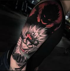 a man with a demon tattoo on his arm