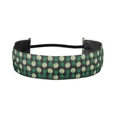 a black and green headband with circles on it