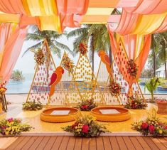 Go beyond the classic marigold and incorporate a vibrant array of climbing flowers to create stunning archways and backdrops for your Haldi stage. This captivating floral installation can be further enhanced with an oversized wedding hashtag prop. Pithi Decoration, Haldi Setup Decor, Haldi Stage Decoration, Mehendi Decoration, Indian Ceremony, Small Wedding Decor